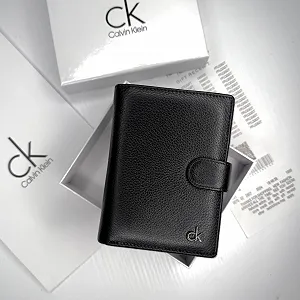 Мужской портмоне кожаный вертикальный на кнопке Calvin Klein цена на synthetic.ua - Фото 1 Мужской портмоне кожаный вертикальный на кнопке Calvin Klein synthetic.ua - Фото 1