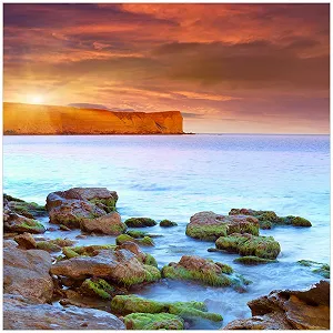 Скляна картина Wallario Sunrise at the Sea with Headland and Rocks in Water 55 x 55 см - Фото 1